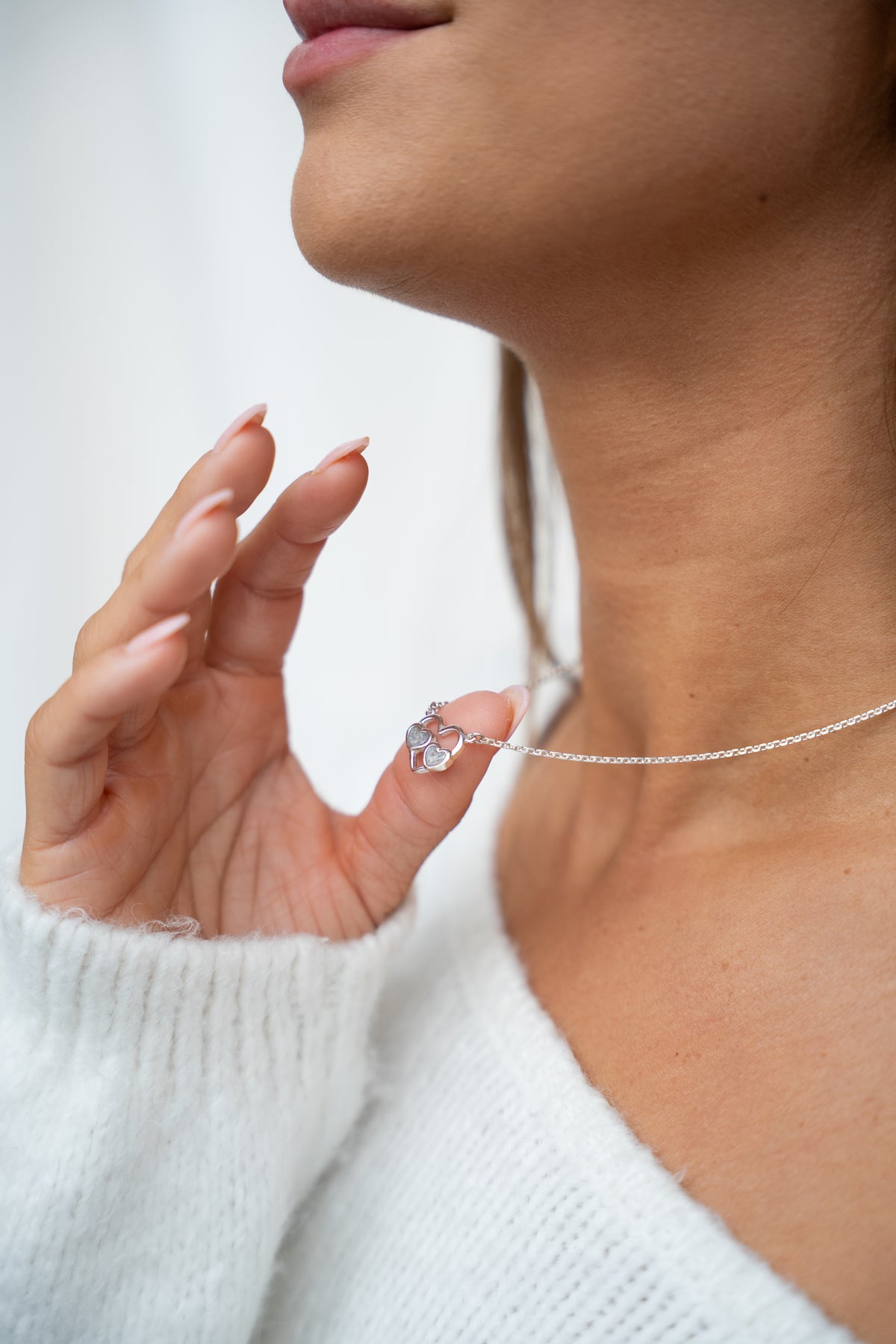 Trinity asketting in goud, gedragen